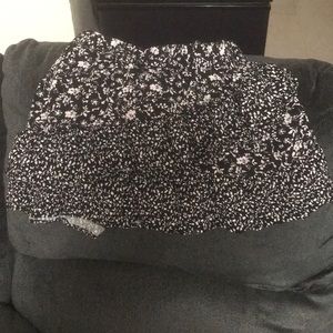 Black and white flowers all around.